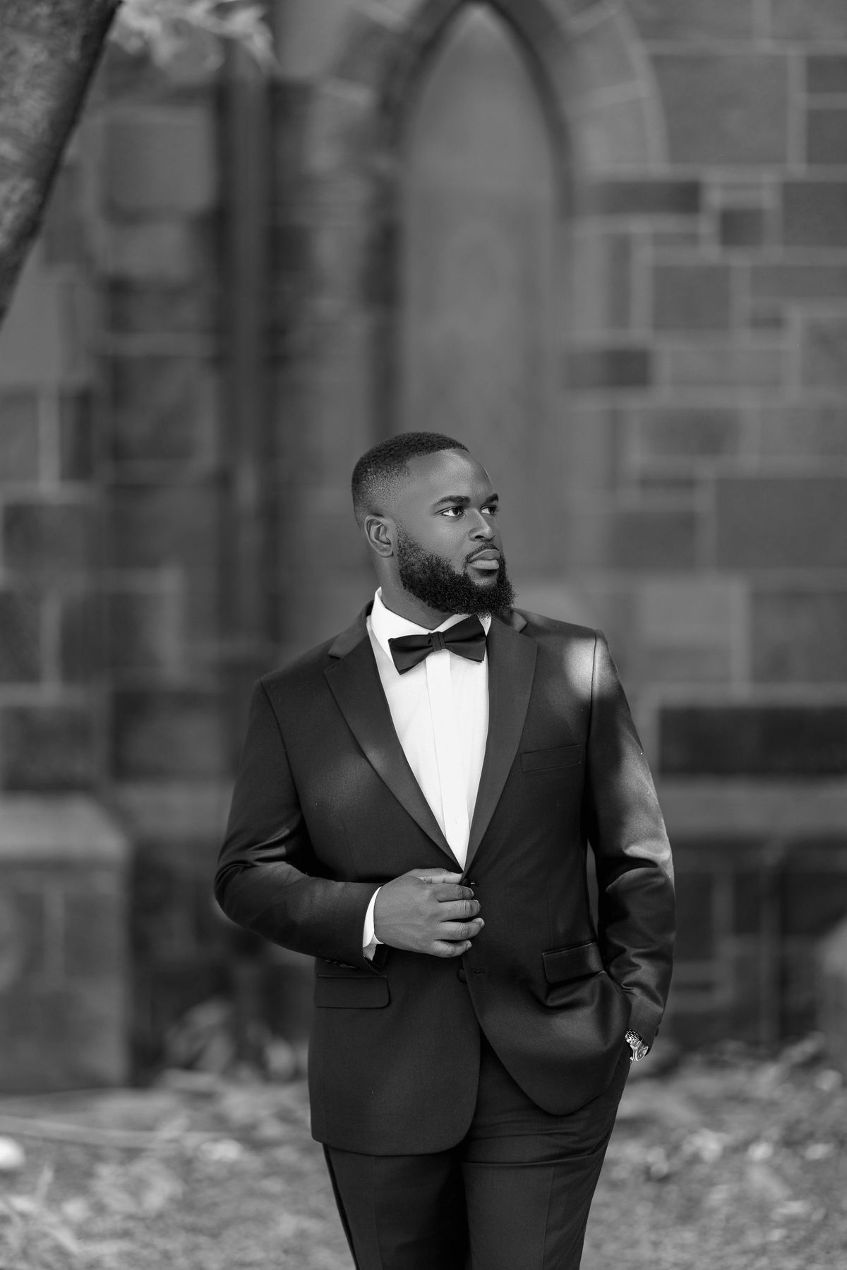Portrait of Uriel Tettey in a leather jacket against a dark background